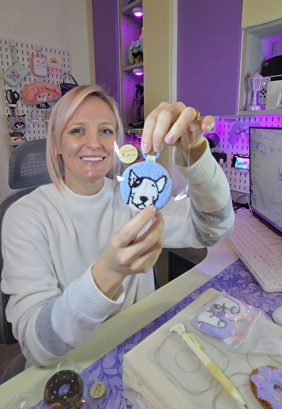 Stefni holding a handmade LotsaLoops punch needle accessory in her Cape Town workspace