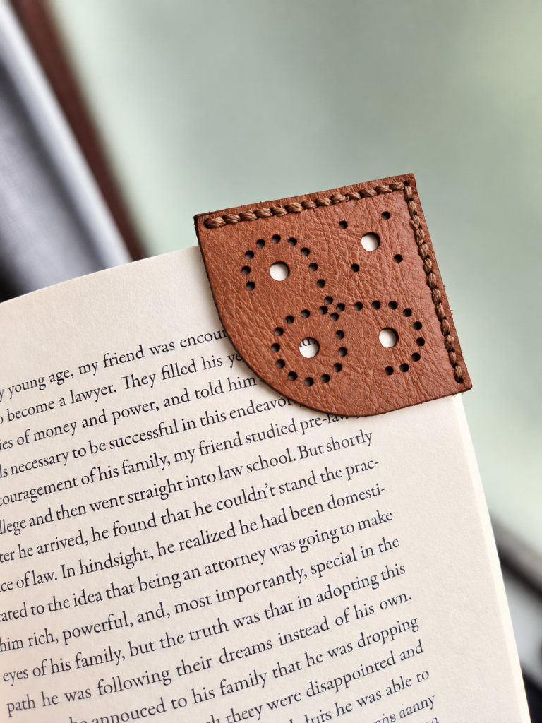 Pattern leather corner bookmark shown on book page