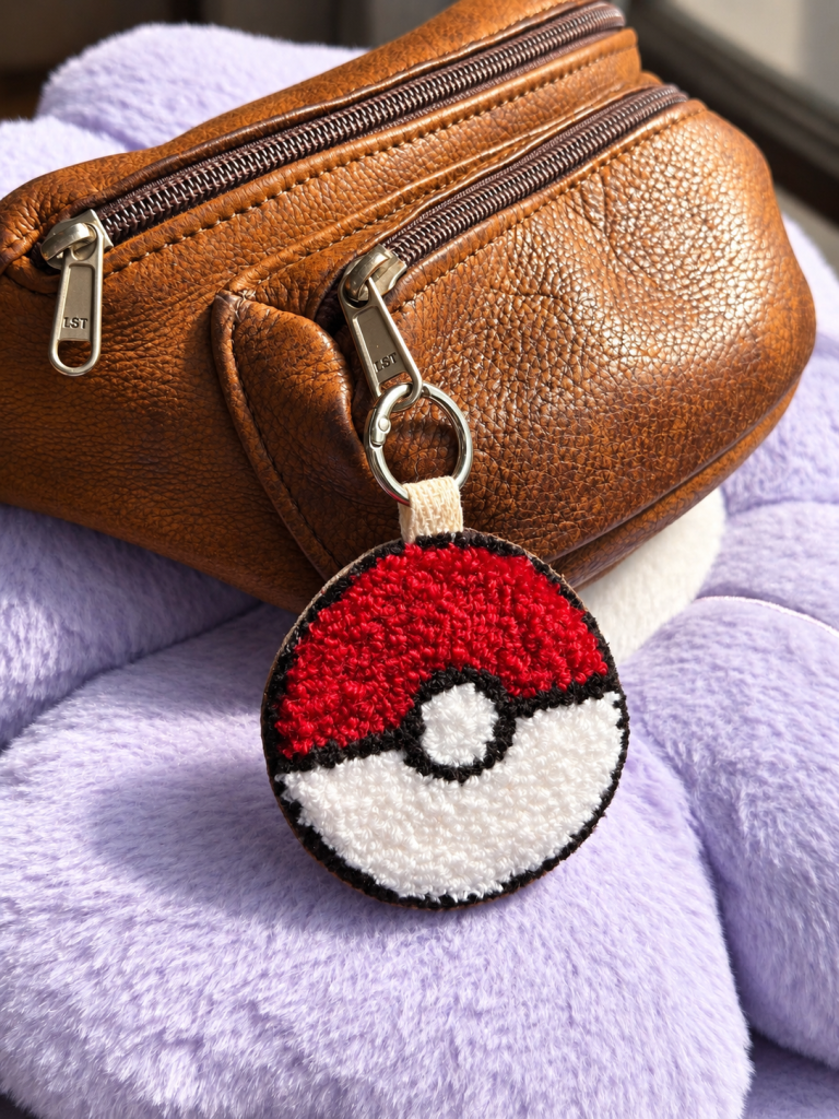 Poké Ball punch needle 2-in-1 accessory used as a bag charm