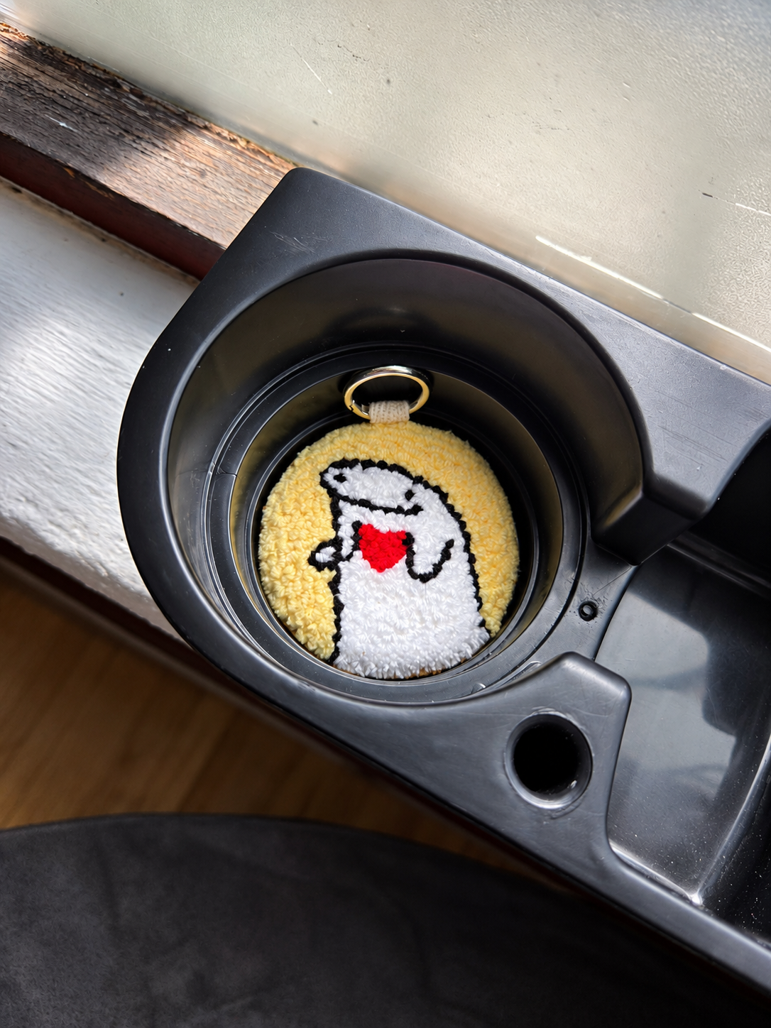 Stickman Love 2-in-1 accessory used as a car cup-holder coaster